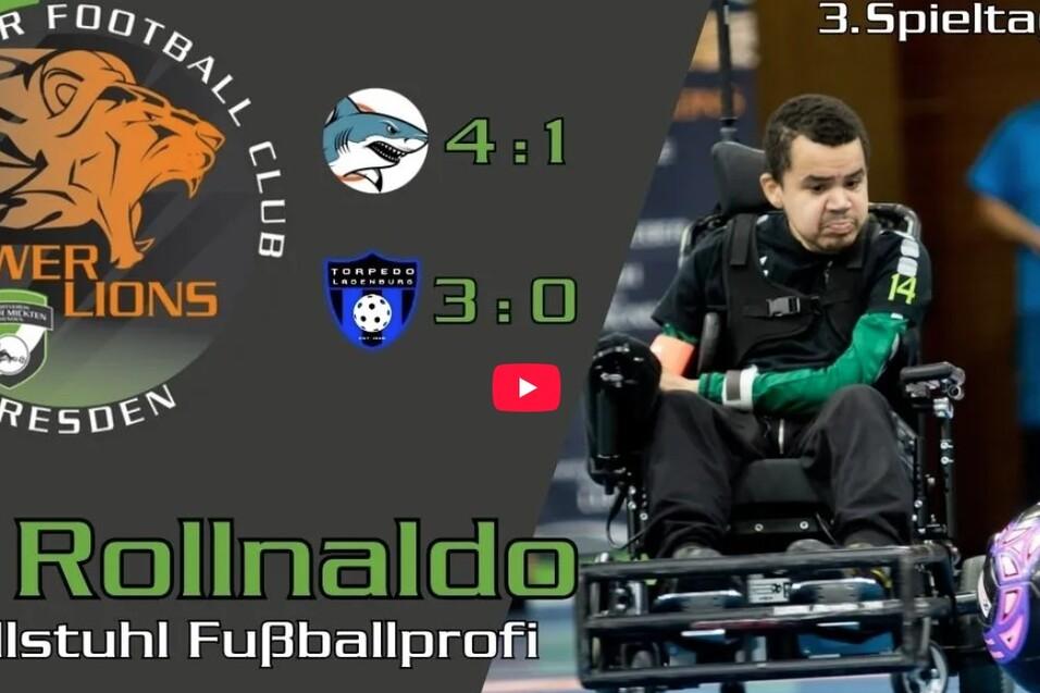 E-Rollstuhl-Fu&szlig;baller A. Rollnaldo in Aktion, w&auml;hrend ein Spielstand von 4:1 angezeigt wird, 3. Spieltag in Bonn.